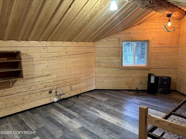 additional living space with vaulted ceiling, wood walls, wood ceiling, and dark wood finished floors