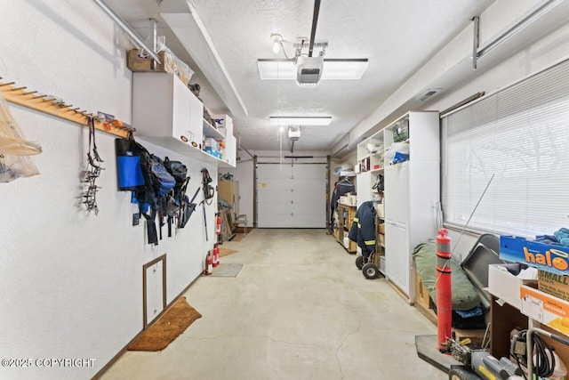 23675 Glacier View Dr, Eagle River, AK 99577 - garage featuring a garage door opener