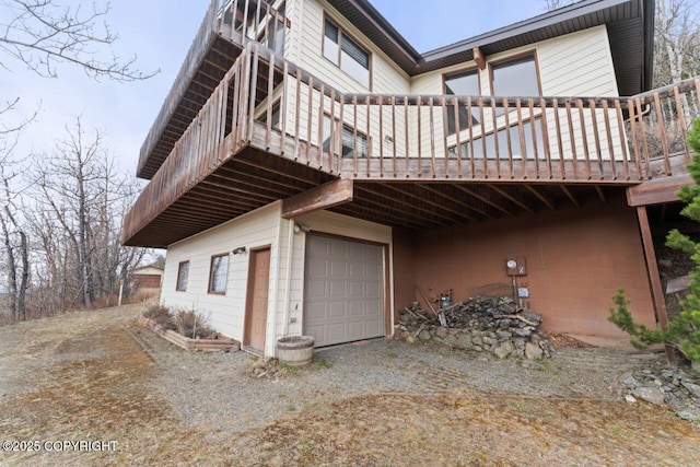 23675 Glacier View Dr, Eagle River, AK 99577 - view of home's exterior featuring driveway and a wooden deck