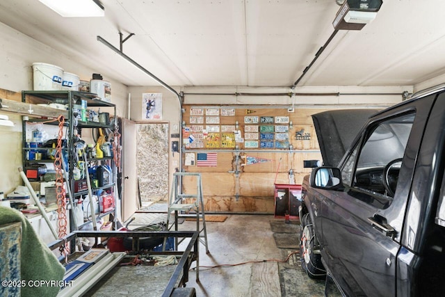 23675 Glacier View Dr, Eagle River, AK 99577 - garage featuring a garage door opener
