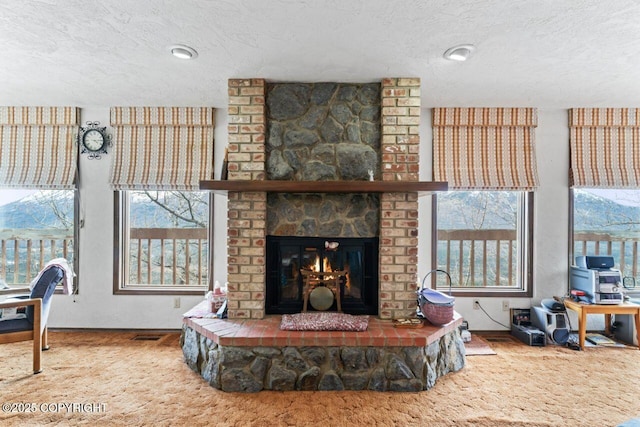 23675 Glacier View Dr, Eagle River, AK 99577 - living room with baseboards, a fireplace, and a textured ceiling