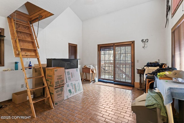 23675 Glacier View Dr, Eagle River, AK 99577 - interior space with brick floor and a towering ceiling