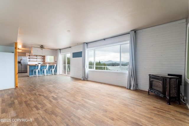 430 Washington St, Ketchikan, AK 99901 - unfurnished living room with a wood stove and hardwood / wood-style flooring