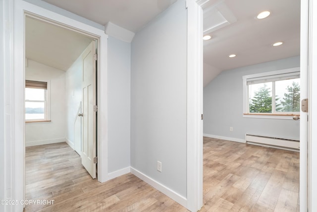 430 Washington St, Ketchikan, AK 99901 - hallway featuring light wood-type flooring, lofted ceiling, baseboard heating, and a healthy amount of sunlight