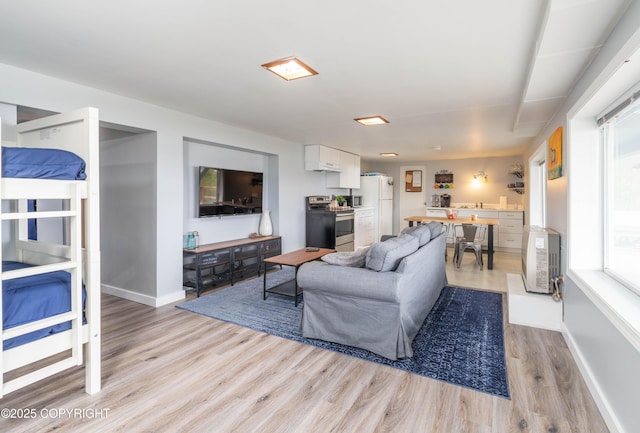 430 Washington St, Ketchikan, AK 99901 - living room with baseboards and light wood-style flooring