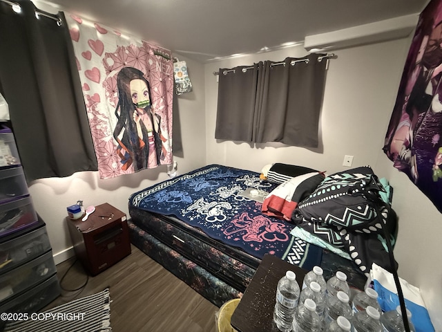 bedroom featuring wood finished floors