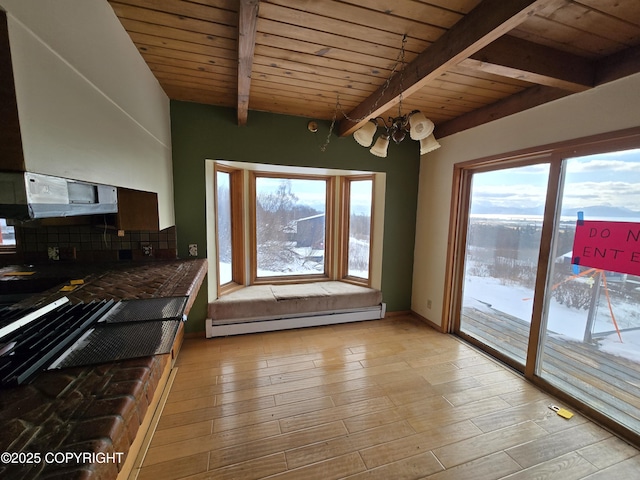 interior space featuring an inviting chandelier, wood ceiling, baseboard heating, and beamed ceiling