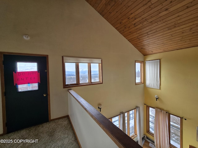 interior space with wood ceiling and high vaulted ceiling