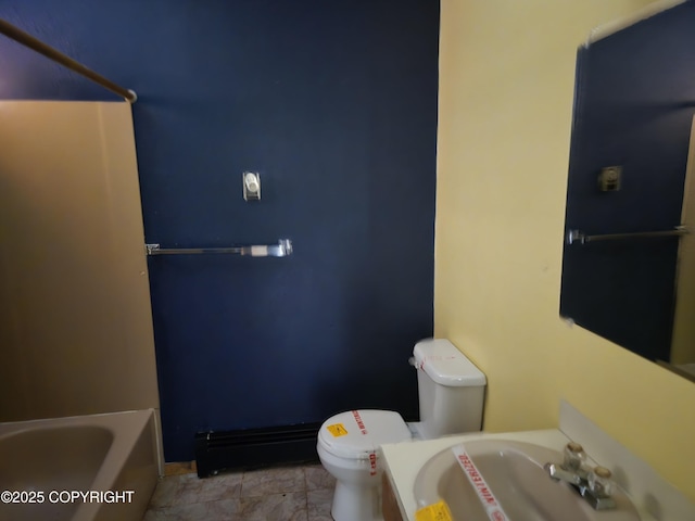 bathroom featuring a sink, toilet, and a bathtub