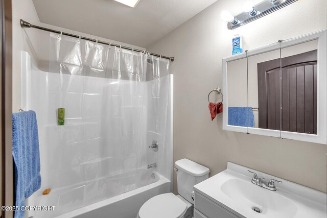 full bath featuring vanity, shower / bath combination with curtain, and toilet