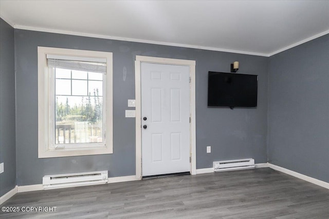 1369 Morning Glory Loop, North Pole, AK 99705 - entryway with baseboard heating, ornamental molding, wood finished floors, and baseboards