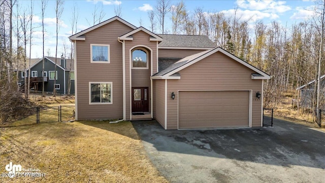 7865 S Settlers Bay Dr, Wasilla, AK 99623 - traditional-style home with driveway, an attached garage, fence, and a gate