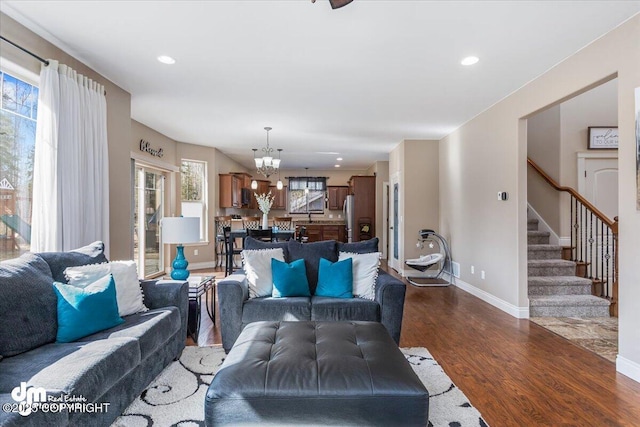 7865 S Settlers Bay Dr, Wasilla, AK 99623 - living area featuring stairs, baseboards, dark wood-style floors, a chandelier, and recessed lighting