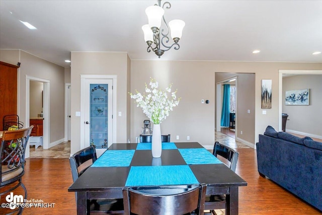 7865 S Settlers Bay Dr, Wasilla, AK 99623 - dining space with an inviting chandelier, recessed lighting, baseboards, and wood finished floors