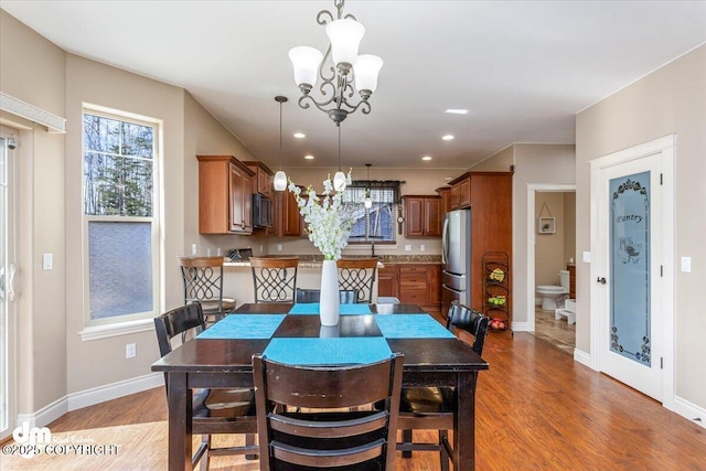 7865 S Settlers Bay Dr, Wasilla, AK 99623 - dining area with recessed lighting, baseboards, a notable chandelier, and light wood-style flooring