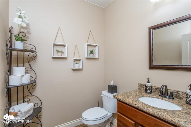 7865 S Settlers Bay Dr, Wasilla, AK 99623 - bathroom with vanity, baseboards, and toilet