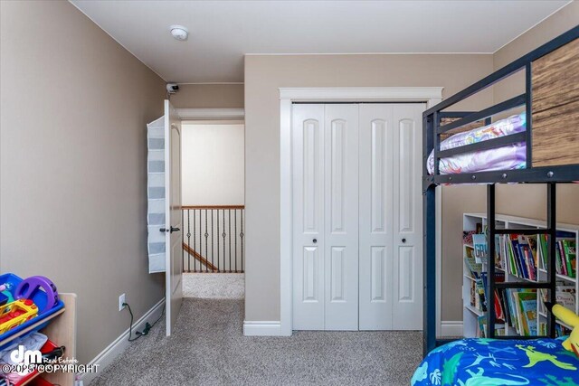 7865 S Settlers Bay Dr, Wasilla, AK 99623 - carpeted bedroom featuring baseboards and a closet