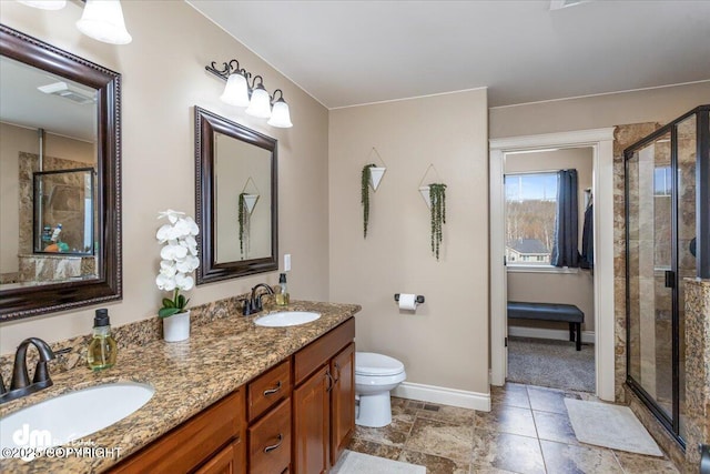 7865 S Settlers Bay Dr, Wasilla, AK 99623 - bathroom with baseboards, a sink, and a stall shower