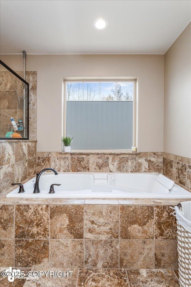 7865 S Settlers Bay Dr, Wasilla, AK 99623 - full bathroom with a garden tub and tiled shower