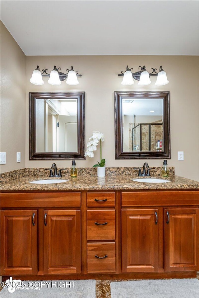 7865 S Settlers Bay Dr, Wasilla, AK 99623 - bathroom featuring a sink, walk in shower, and double vanity