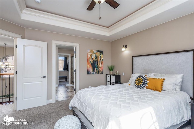7865 S Settlers Bay Dr, Wasilla, AK 99623 - carpeted bedroom with crown molding, a raised ceiling, baseboards, and connected bathroom