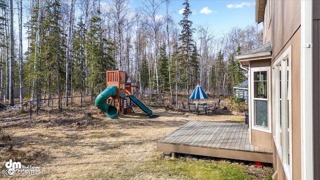 7865 S Settlers Bay Dr, Wasilla, AK 99623 - view of play area featuring fence and a deck