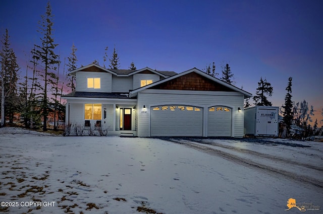 view of front of house with a porch, a garage, and driveway