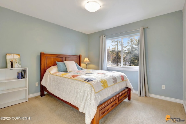 bedroom featuring baseboards and light carpet