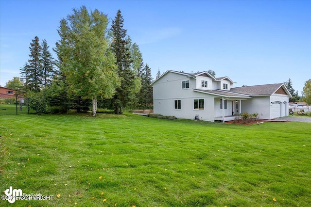 exterior space with a lawn and a garage