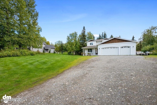 view of front of home with dirt driveway, an attached garage, and a front yard