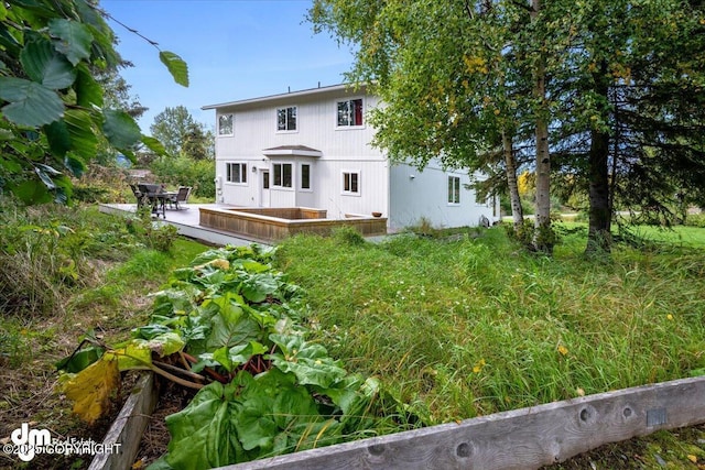 back of property with a patio area