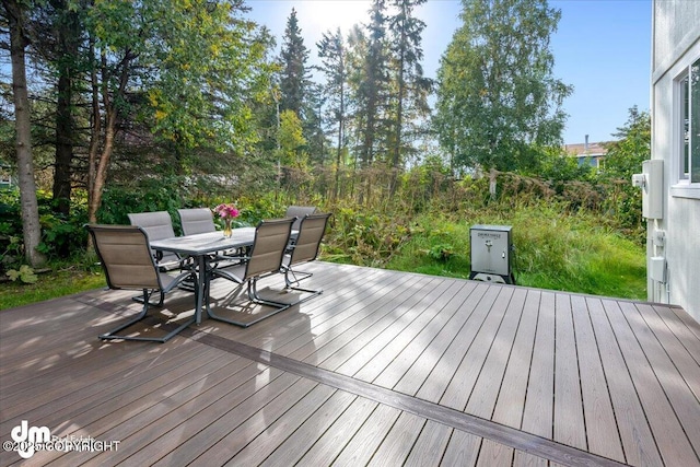 deck featuring outdoor dining area