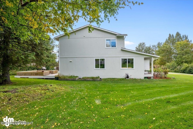 view of side of property featuring a yard