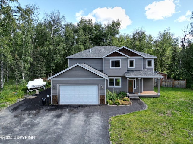 7779 N Showers St, Palmer, AK 99645 - view of front facade with aphalt driveway, fence, a front lawn, an attached garage, and a shingled roof