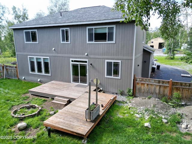 7779 N Showers St, Palmer, AK 99645 - back of property with a lawn, a shingled roof, fence, and a deck