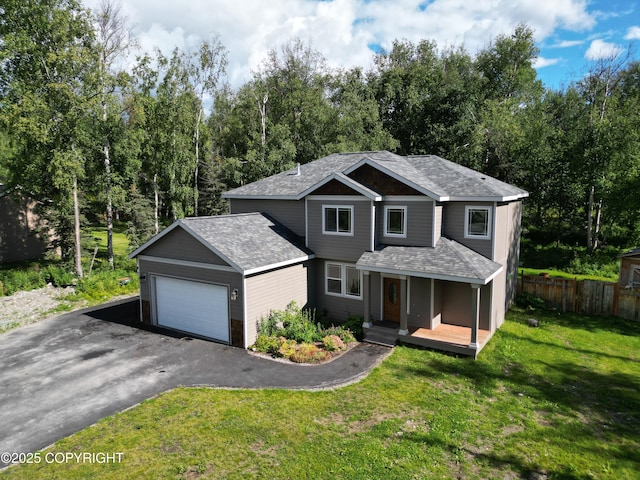 7779 N Showers St, Palmer, AK 99645 - traditional home featuring roof with shingles, fence, aphalt driveway, a garage, and a front yard