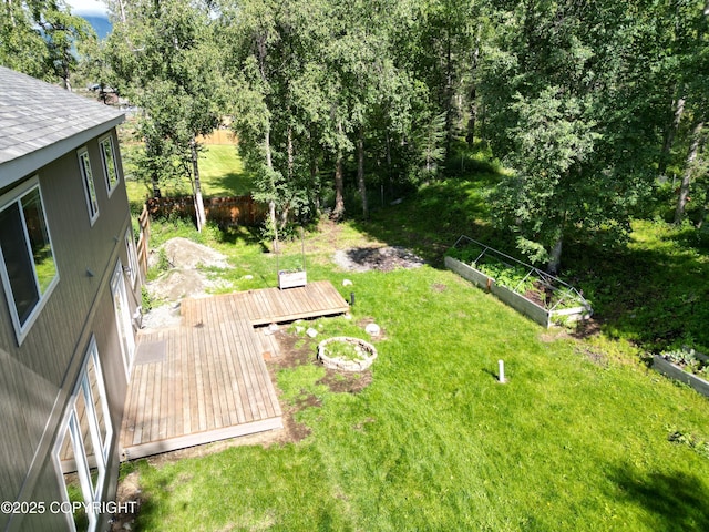 7779 N Showers St, Palmer, AK 99645 - view of yard featuring a garden and a deck
