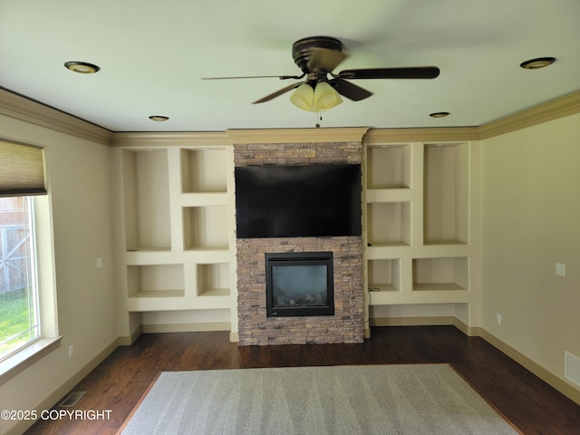7779 N Showers St, Palmer, AK 99645 - unfurnished living room with ceiling fan, a stone fireplace, visible vents, wood finished floors, and baseboards