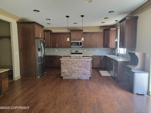 7779 N Showers St, Palmer, AK 99645 - kitchen with a kitchen island, light stone countertops, dark wood-style floors, appliances with stainless steel finishes, and backsplash