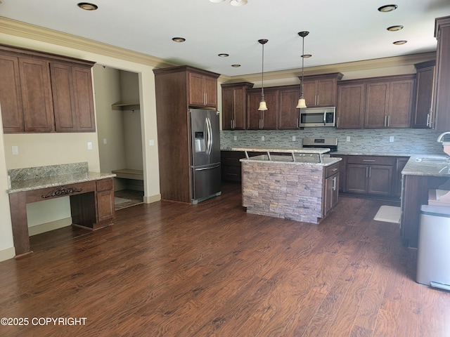 7779 N Showers St, Palmer, AK 99645 - kitchen featuring light stone countertops, a center island, a sink, appliances with stainless steel finishes, and backsplash