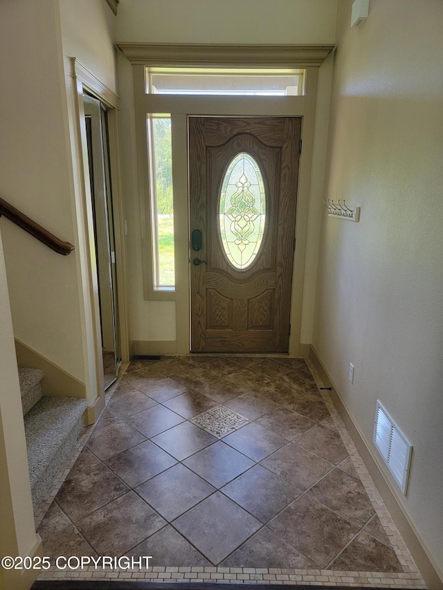 7779 N Showers St, Palmer, AK 99645 - foyer entrance featuring stairs, baseboards, and visible vents