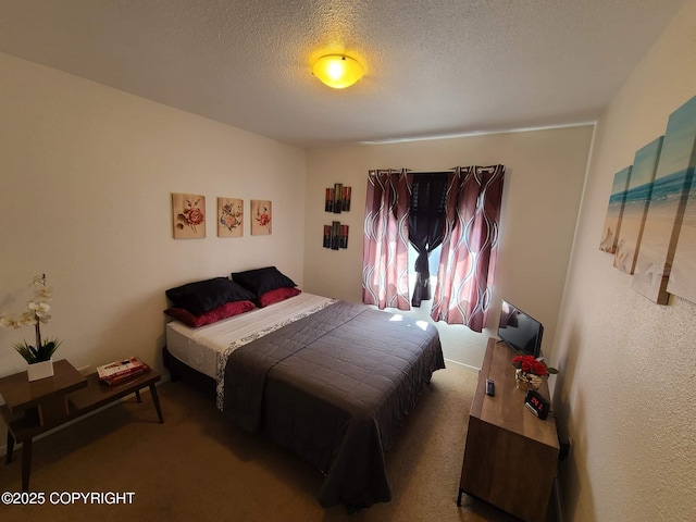 carpeted bedroom with a textured ceiling