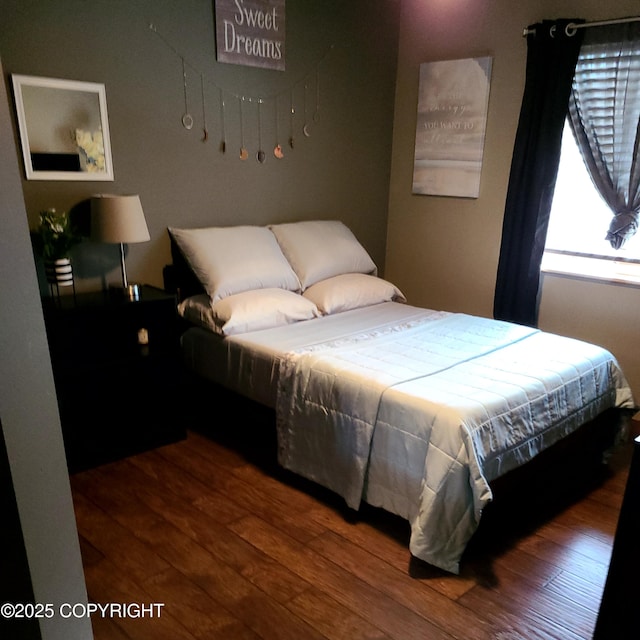 bedroom featuring hardwood / wood-style floors