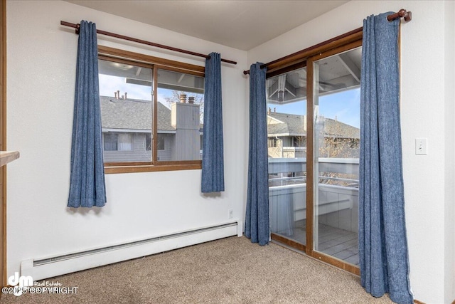 4241 Folker St # D202, Anchorage, AK 99508 - spare room with baseboard heating and carpet flooring