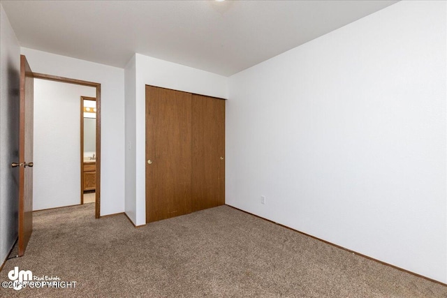 4241 Folker St # D202, Anchorage, AK 99508 - unfurnished bedroom with carpet and a closet
