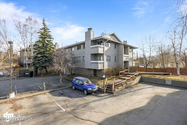 4241 Folker St # D202, Anchorage, AK 99508 - exterior space featuring fence and uncovered parking