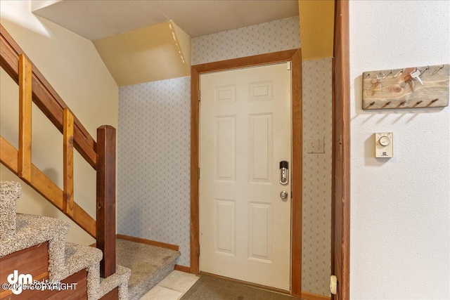 337 Alta Dr, Girdwood, AK 99587 - foyer entrance featuring stairway and wallpapered walls