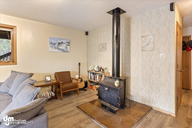 337 Alta Dr, Girdwood, AK 99587 - living area featuring wood finished floors and a wood stove