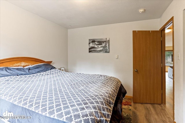 337 Alta Dr, Girdwood, AK 99587 - bedroom featuring wood finished floors