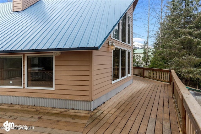337 Alta Dr, Girdwood, AK 99587 - view of side of home featuring metal roof, a chimney, and a deck